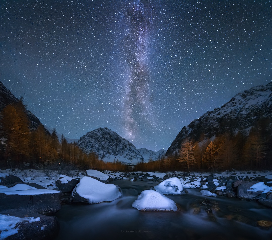 Starry night over the mountain Aktru in Altai
