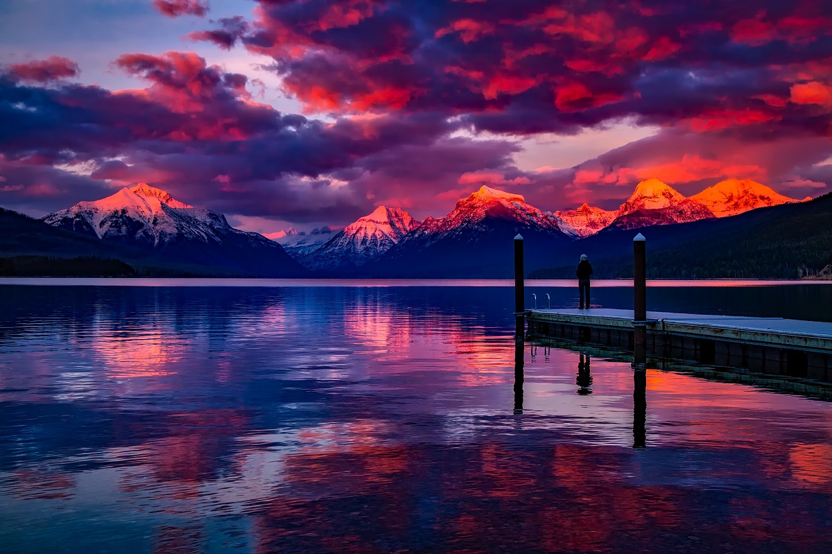 Photo of a sunset over a mountain lake