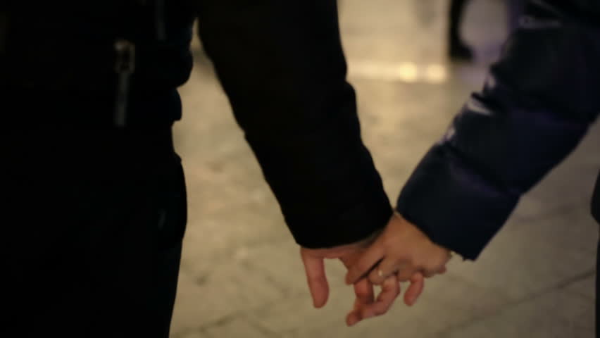 Boy and girl hold hands
