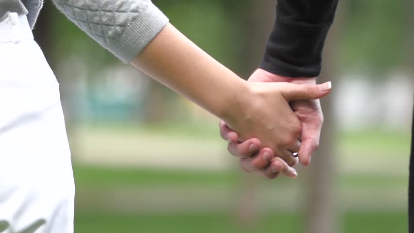 Boy and girl hands hands