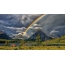 Beautiful photo: a rainbow over a picturesque place in the mountains