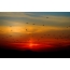 Sunset Photo: Birds Flying Following the Setting Sun