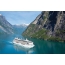 Cruise liner goes along the fjord of Norway