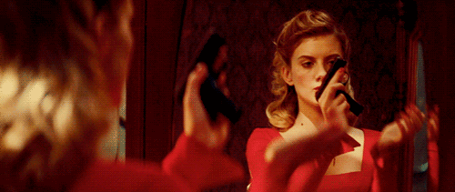 GIF picture: girl with a gun