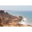 Ακτή της Δυτικής Σαχάρας, σκληρός ήλιος και πετάει γύρω
