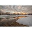 Fotot e dimrit: perëndimi i diellit nga lumi në dimër